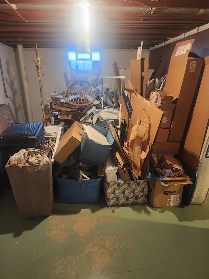 Roll-off dumpster container at job site for 2 Yard Dumpster Rental in Drum Point